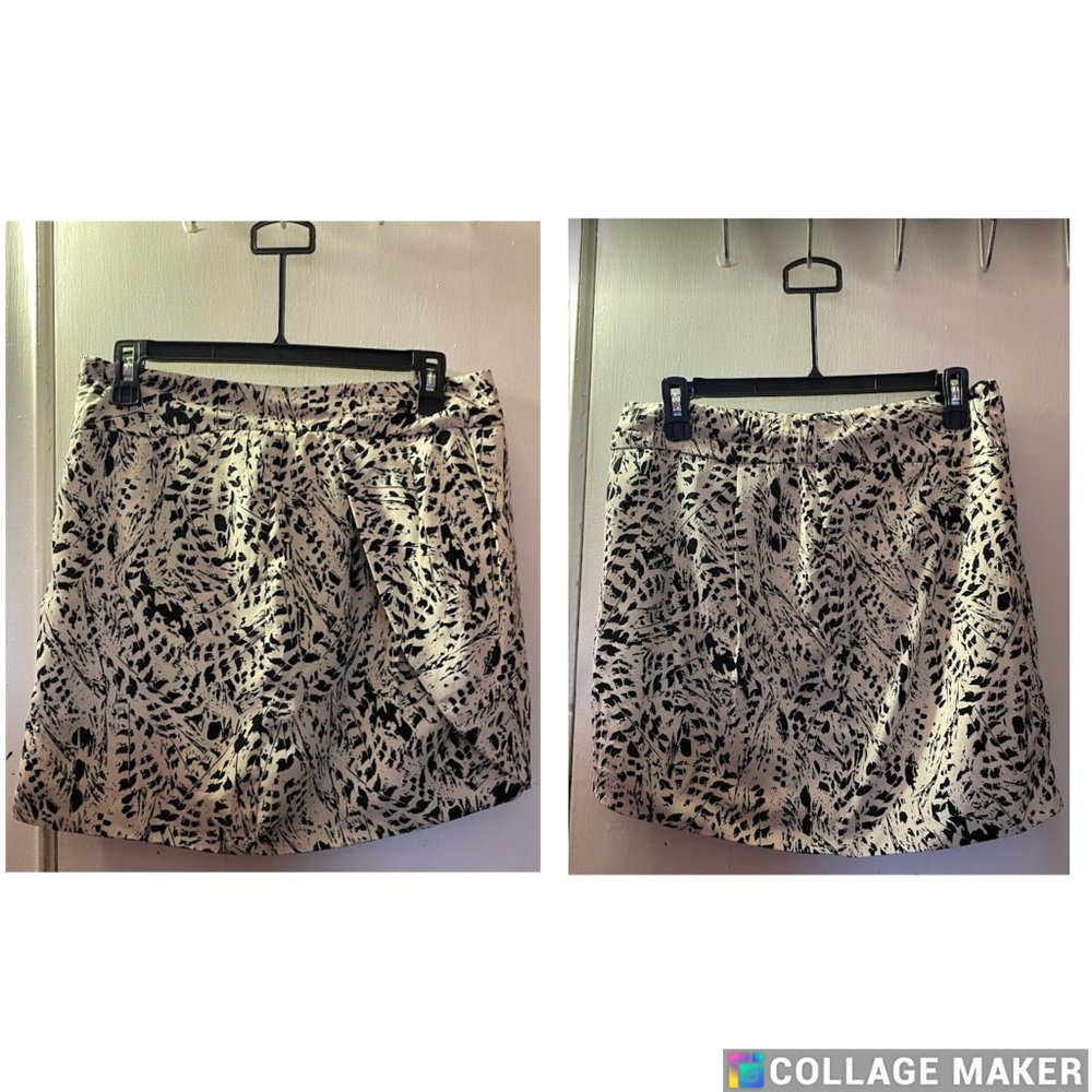 Cream colored with black abstract print Tulip shaped skirt.